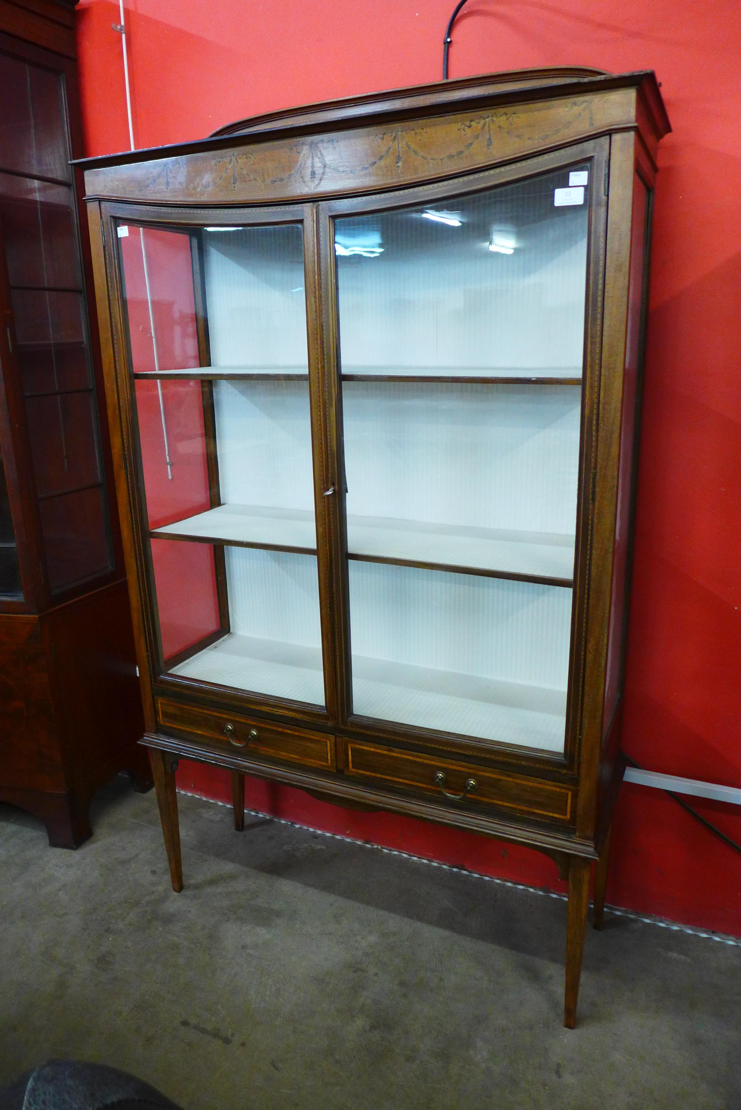 An Edward VII inlaid mahogany two door display cabinet