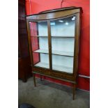 An Edward VII inlaid mahogany two door display cabinet