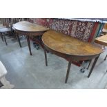 A pair of George III mahogany demi-lune console tables