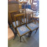 A set of four oak dining chairs