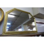 A gilt framed overmantel mirror