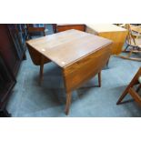 An Ercol elm and beech 383 model drop-leaf table