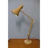 A beige metal anglepoise desk lamp