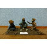 Manner of Franz Bergman, painted bronze figure group of three boys playing dice game