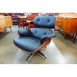 A Charles & Ray Eames style rosewood effect and faux black leather revolving lounge chair