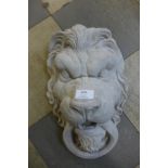 A concrete lion face mask