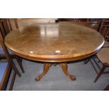 A Victorian figured walnut oval tilt-top loo table