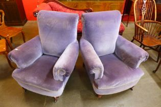 A pair of Victorian Howard style mahogany and fabric upholstered armchairs