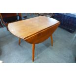 An Ercol Blonde elm and beech 384 model drop-leaf table