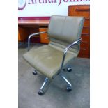 A chrome and grey vinyl revolving desk chair