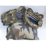 A collection of British military items including belt, camel bag, helmet cover, etc.