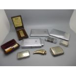 A collection of vintage cigarette cases and lighters, etc.