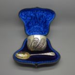 A Victorian silver bowl and spoon, London 1892/3, with gilt interior, in a fitted case, 96g