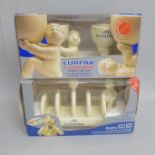 A Lurpak limited edition egg cup set and a toast rack, boxed