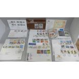 A collection of loose stamps and first day covers
