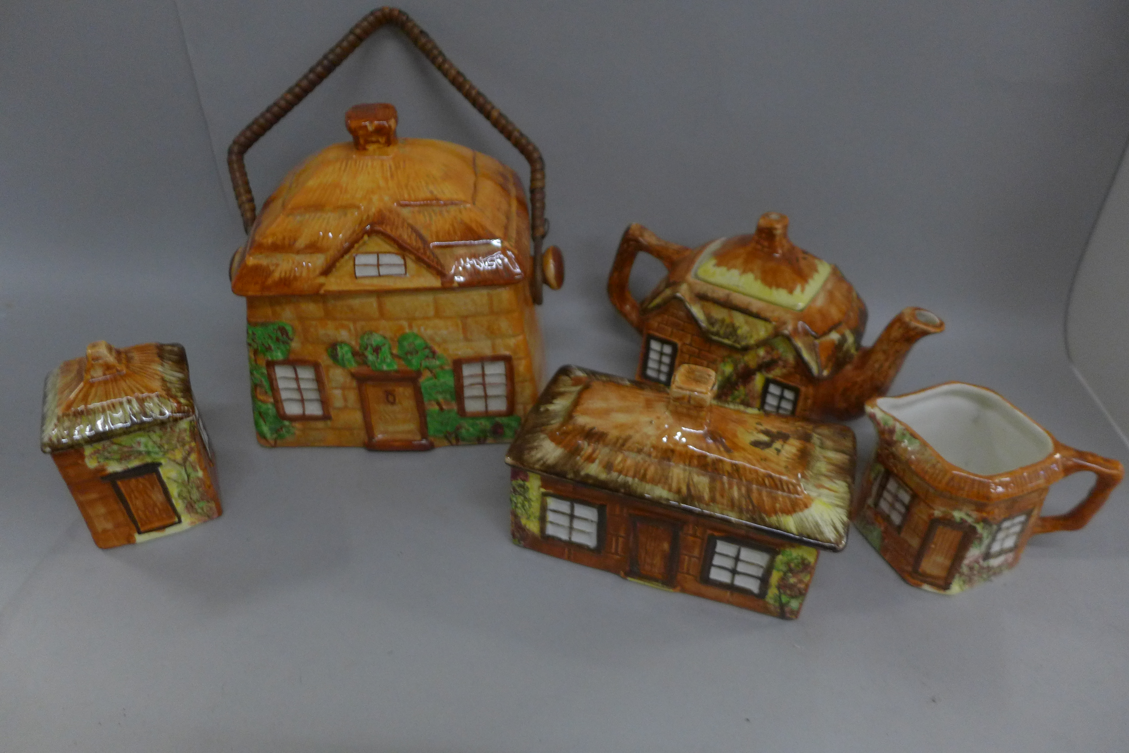 Price Kensington and other cottage ware china; biscuit barrel, butter dish, teapot, milk jug and