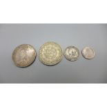 A Victorian 1887 double florin, two other Victorian coins and on other coin