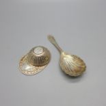 A silver jockey cap caddy spoon and one other silver caddy spoon