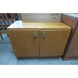 A teak two door cabinet