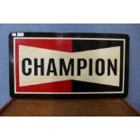 A painted metal Champion advertising sign