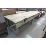A large industrial pine work bench