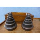 Two sets of nine cast iron weights