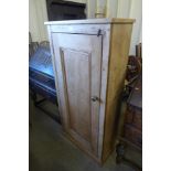 A pine single door kitchen cupboard