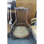 An Arts and Crafts beech bergere armchair