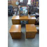 A Stag teak dressing table and a pair of bedside chests