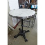 A cast iron and marble topped pub table