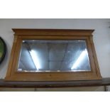A pine framed overmantel mirror