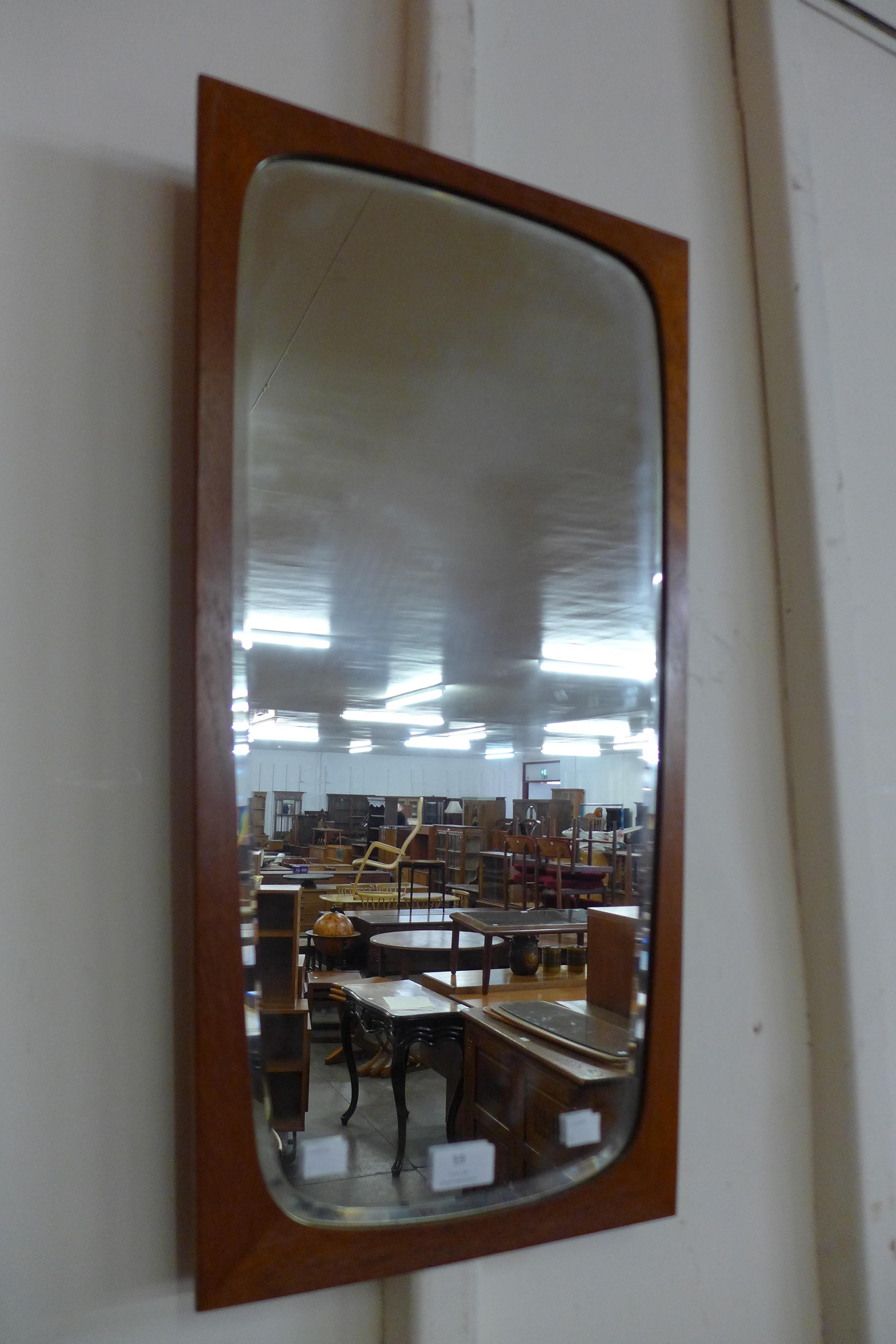 A Danish teak framed bevelled mirror