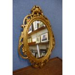 A rococo style gilt framed mirror
