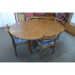 A G-Plan Fresco teak extending dining table and four chairs