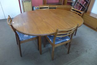 A G-Plan Fresco teak extending dining table and four chairs