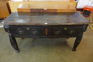 A 17th Century carved oak two drawer dresser
