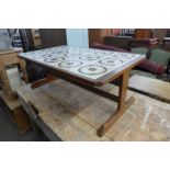 A teak and tiled top coffee table