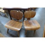A pair of Eames style beech and plywood chairs