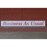 A Business As Usual sign