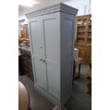 A Victorian painted pine and beech two door housekeeper's cupboard