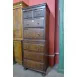 A Victorian oak and burr walnut chest on chest