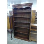 A mahogany open bookcase