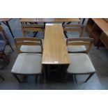 A teak drop-leaf table and four chairs