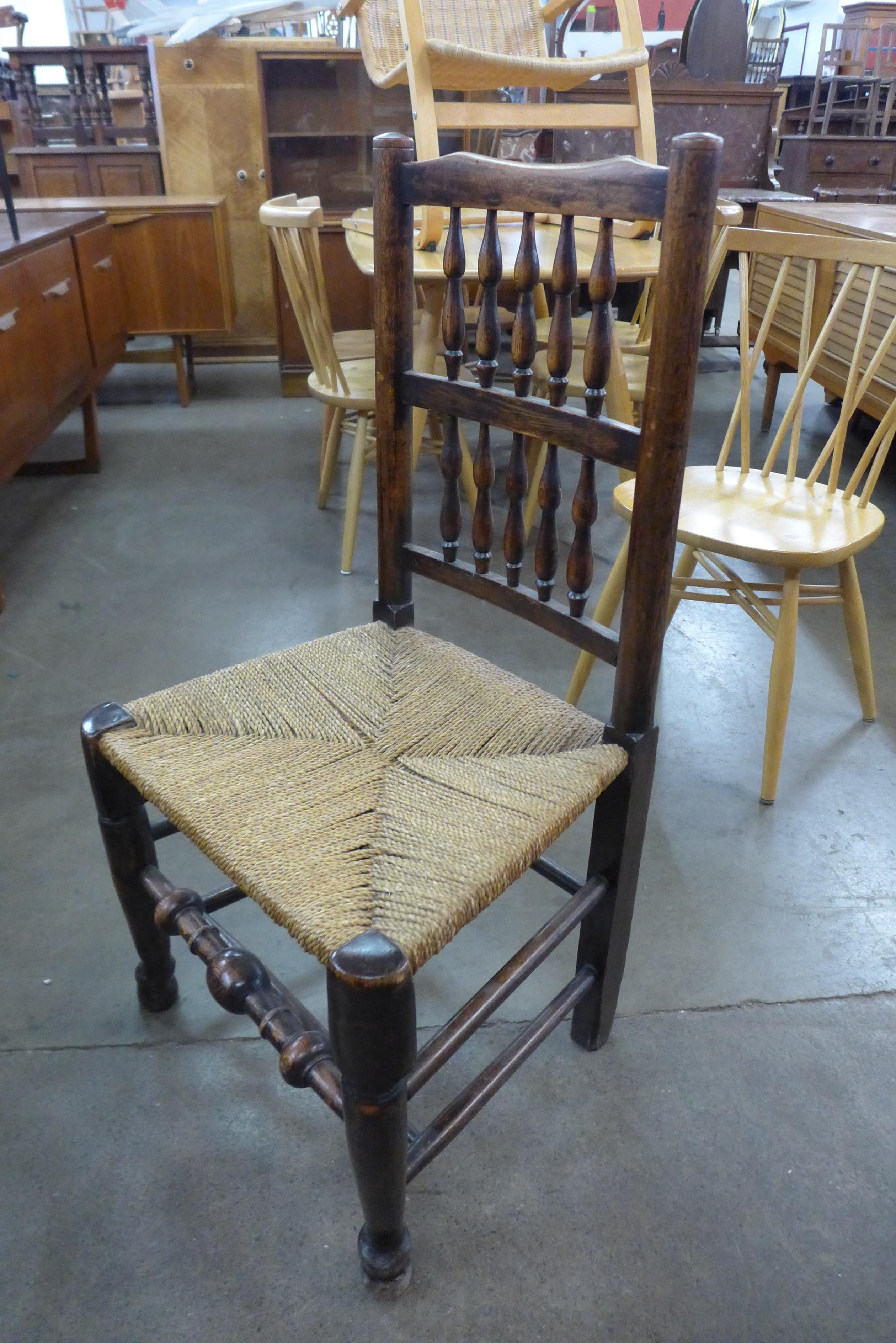 A set of six Georg III style elm and ash spindle back rush seated chairs - Image 2 of 2