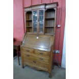 An Arts and Crafts oak bureau bookcase, attributed to Liberty & Co.