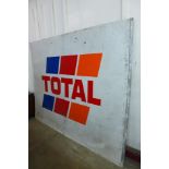 A large metal Total advertising sign