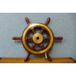 A brass and wooden ship's wheel