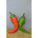 Two large painted papier mache chillies