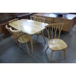An Ercol Blonde ash dining table and six chairs