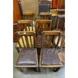 A set of four oak dining chairs and two others